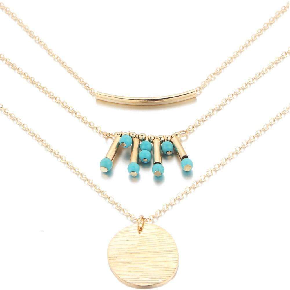 Gold Layered Necklace with Turquoise Bead Accents and Round Pendant