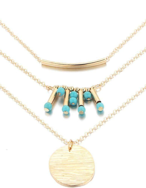 Load image into Gallery viewer, Gold Layered Necklace with Turquoise Bead Accents and Round Pendant
