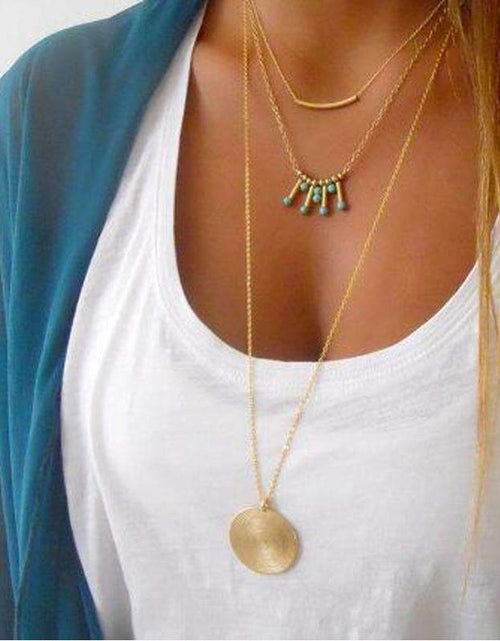 Load image into Gallery viewer, Gold Layered Necklace with Turquoise Bead Accents and Round Pendant
